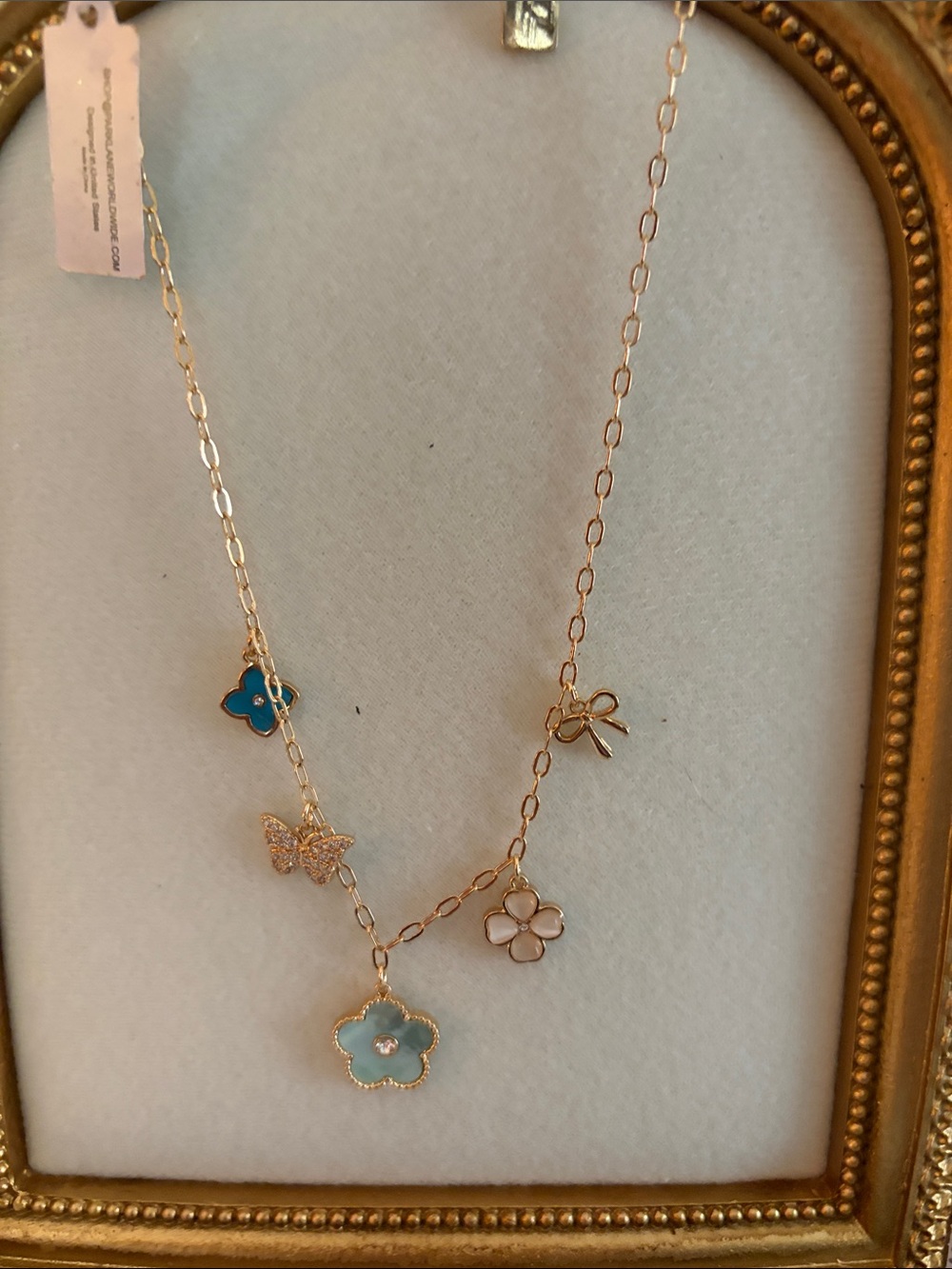 Park Lane Gold Floral Pendant Necklace with Blue and White Accents